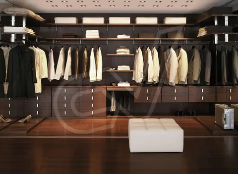 Vestidor con barras de ropa, cajoneras e iluminación superior